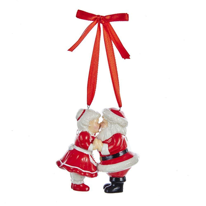 Kurt Adler porcelain kissing Santa and Mrs. Claus Christmas ornament with red ribbon hanger, 3.5 inches tall