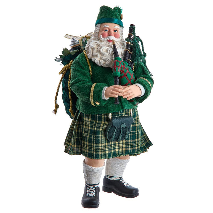 Kurt Adler 10.5-Inch Fabriche Musical Irish Bagpiper Santa - fabric Santa in Irish kilt holding red and green bagpipe