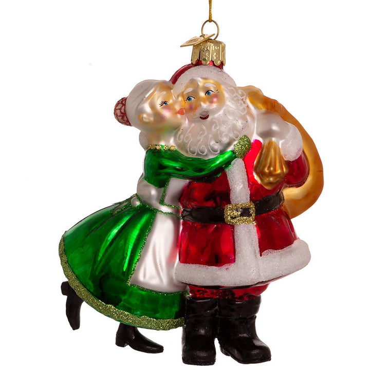 Kurt Adler Noble Gems 5-inch glass ornament - Santa in red suit and Mrs. Claus in green sharing a kiss
